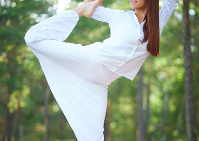 young woman doing tai chi stretches