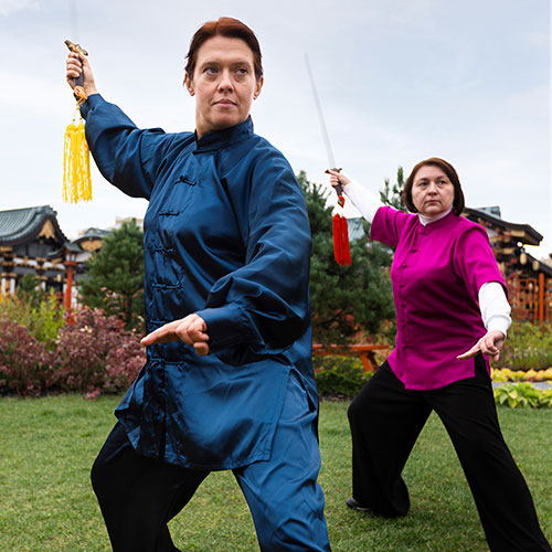 Two women doing tai chi